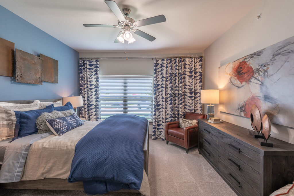 bedroom with dresser and 2 panel window